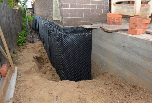 Happy homeowners after waterproofing job in Mukwonago